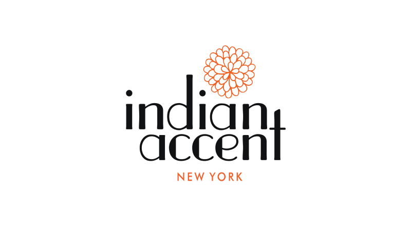 A logo of the Indian Accent, USA